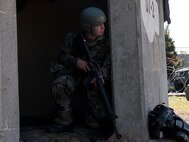 An Airman provides security at an entry control point during Exercise Beverly Midnight 15-1, Oct. 23, 2014. The four-day exercise demonstrated the Wolf Pack's ability to work alongside Republic of Korea air force allies as well as their capability of responding to wartime and armistice threats. (U.S. Air Force photo by Senior Airman Katrina Heikkinen/Released)