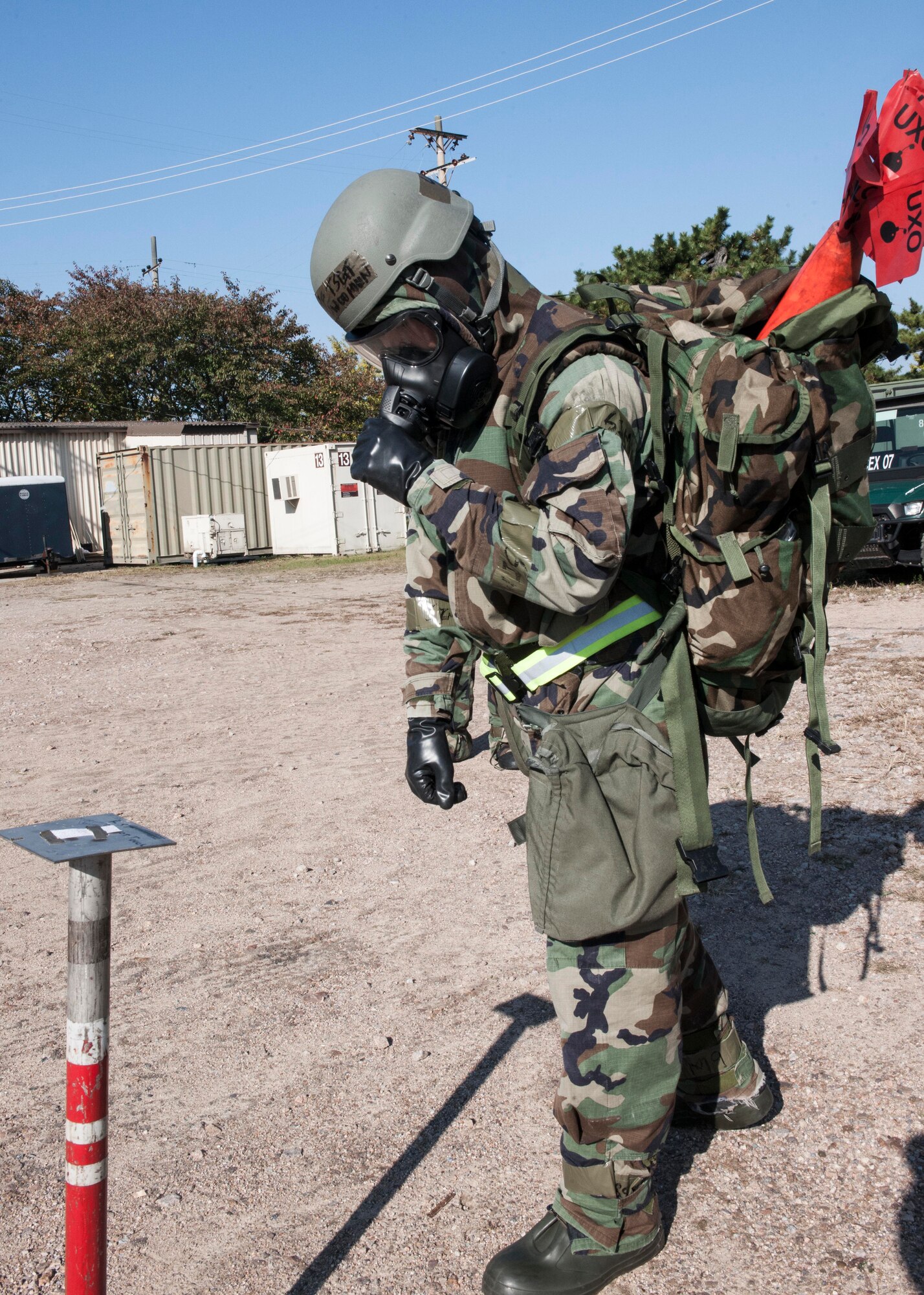 A Wolf Pack Airman inspects M8 chemical detection paper during Exercise Beverly Midnight 15-1, Oct. 23, 2014. The four-day exercise demonstrated the Wolf Pack's ability to work alongside Republic of Korea air force allies as well as their capability of responding to wartime and armistice threats. (U.S. Air Force photo by Senior Airman Katrina Heikkinen/Released)