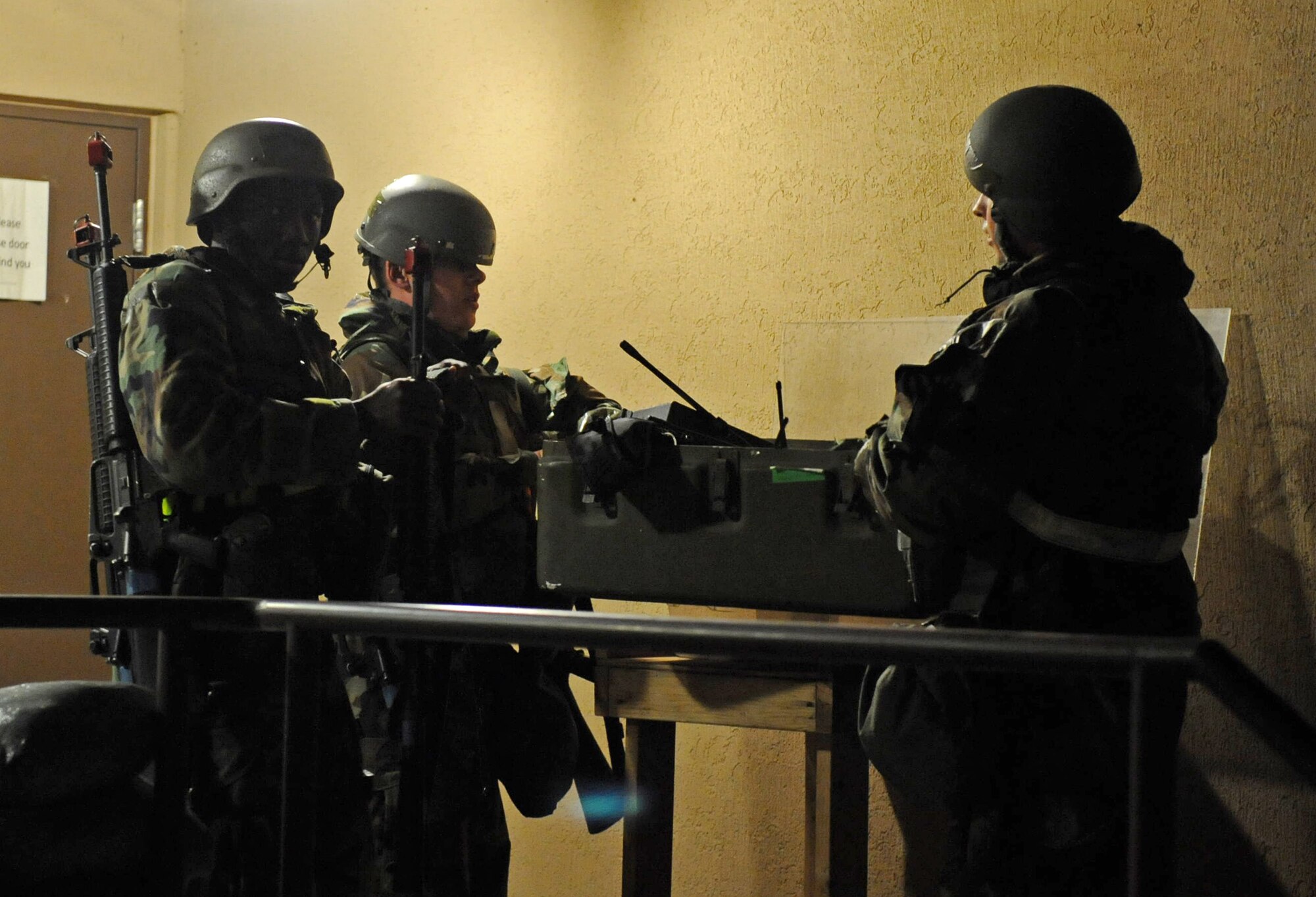 Airmen from the 8th Logistics Readiness Squadron prepare to do a post attack reconnaissance sweep after a simulated missile attack during Exercise Beverly Midnight 15-1, Oct. 22, 2014. The four-day exercise demonstrated the Wolf Pack's ability to work alongside Republic of Korea air force allies as well as their capability of responding to wartime and armistice threats. (U.S. Air Force photo by Senior Airman Divine Cox/Released)