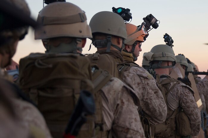 Seaman Robert Carpenter, a hospitalman with Security Platoon, Maritime Raid Force, 24th Marine Expeditionary Unit, waits to board a CH-53E Super Stallion aboard the USS Iwo Jima, Oct. 22, 2014. Marines and Sailors from the MRF conducted a precision raid in southern Georgia during Composite Training Unit Exercise, the last major pre-deployment event before their deployment at the end of the year. (U.S. Marine Corps photo by Cpl. Todd F. Michalek)