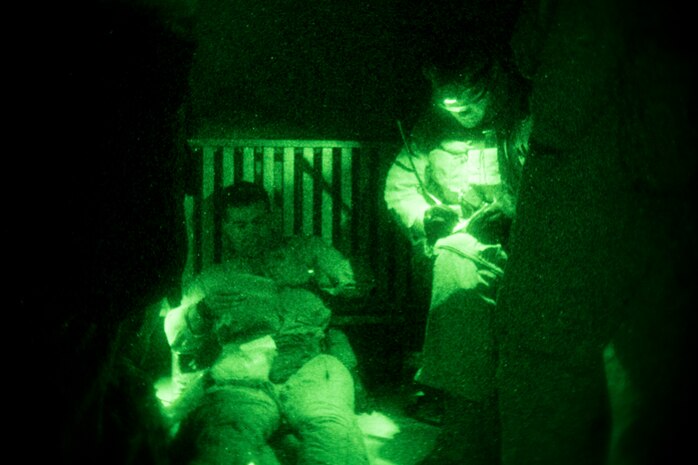 A Navy hospital corpsman, right, with the Maritime Raid Force, 24th Marine Expeditionary Unit, documents the injuries of a simulated casualty during a training exercise in southern Georgia, Oct. 22, 2014. The MRF participated in a precision raid to capture a notional high value individual as part of Composite Training Unit Exercise. The 24th MEU is scheduled to deploy at the end of the year. (U.S. Marine Corps photo by Cpl. Todd F. Michalek)