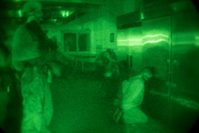 A Marine with Security Platoon, Maritime Raid Force, 24th Marine Expeditionary Unit, guards a simulated detainee during a training exercise in southern Georgia, Oct. 22, 2014. The MRF participated in a precision raid to capture a notional high value individual as part of Composite Training Unit Exercise. The 24th MEU is scheduled to deploy at the end of the year. (U.S. Marine Corps photo by Cpl. Todd F. Michalek)