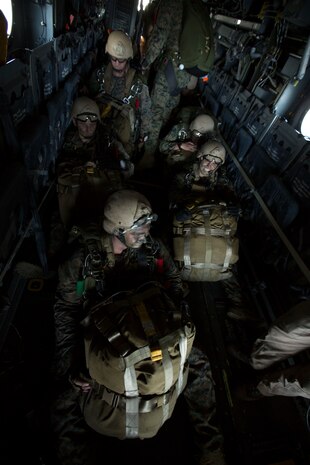 The 24th Marine Expeditionary Unit’s Maritime Raid Force Marines get wait to jump out of a Marine Medium Tiltrotor Squadron 365 (Reinforced), 24th MEU, during Amphibious Ready Group/Marine Expeditionary Unit Exercise aboard the USS Iwo Jima, at sea, Sept. 11, 2014. The Marines with the MRF conducted a Reconnaissance and Surveillance exercise inserting by air.  