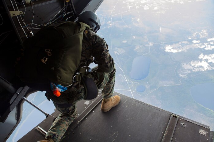 A 24th Marine Expeditionary Unit’s Maritime Raid Force Marine looks out of an MV-22B Osprey from Marine Medium Tiltrotor Squadron 365 (Reinforced), 24th MEU, during Amphibious Ready Group/Marine Expeditionary Unit Exercise aboard the USS Iwo Jima, at sea, Sept. 11, 2014. The Marines with the MRF conducted a Reconnaissance and Surveillance exercise inserting by air.  