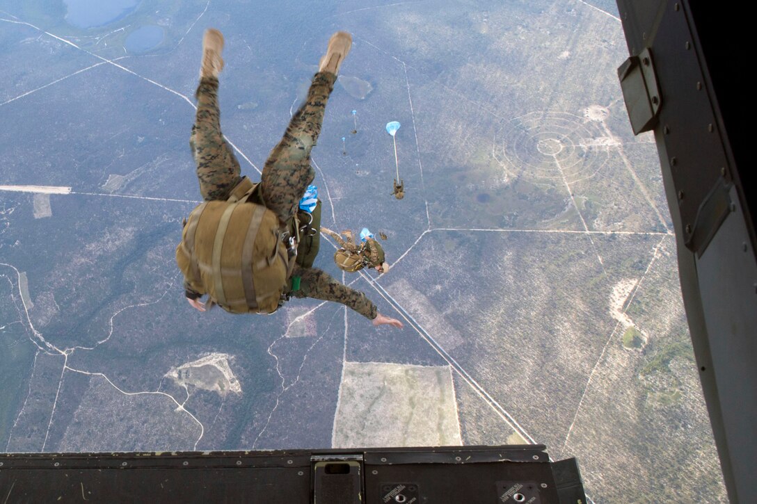 A 24th Marine Expeditionary Unit’s Maritime Raid Force Marine jumps out of an MV-22B Osprey from Marine Medium Tiltrotor Squadron 365 (Reinforced), 24th MEU, during Amphibious Ready Group/Marine Expeditionary Unit Exercise aboard the USS Iwo Jima, at sea, Sept. 11, 2014. The Marines with the MRF conducted a Reconnaissance and Surveillance exercise inserting by air.  