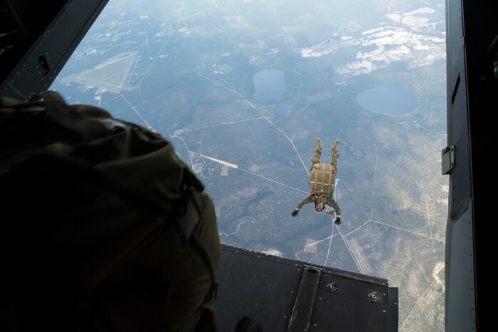 A 24th Marine Expeditionary Unit’s Maritime Raid Force Marine jumps out of an MV-22B Osprey from Marine Medium Tiltrotor Squadron 365 (Reinforced), 24th MEU, during Amphibious Ready Group/Marine Expeditionary Unit Exercise aboard the USS Iwo Jima, at sea, Sept. 11, 2014. The Marines with the MRF conducted a Reconnaissance and Surveillance exercise inserting by air.  