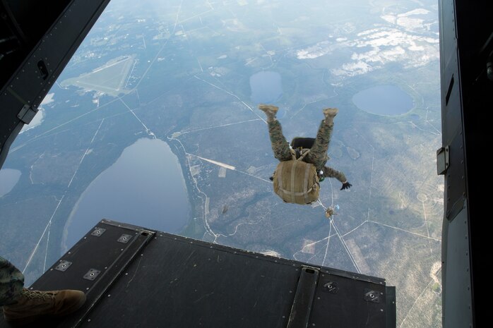 A 24th Marine Expeditionary Unit’s Maritime Raid Force Marine jumps out of an MV-22B Osprey from Marine Medium Tiltrotor Squadron 365 (Reinforced), 24th MEU, during Amphibious Ready Group/Marine Expeditionary Unit Exercise aboard the USS Iwo Jima, at sea, Sept. 11, 2014. The Marines with the MRF conducted a Reconnaissance and Surveillance exercise inserting by air.  
