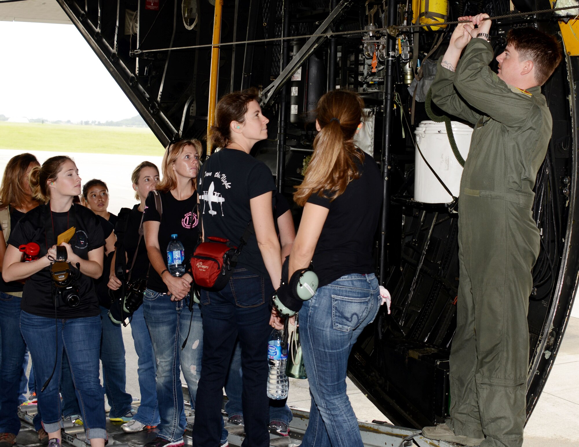 Staff Sgt. Joshua Mills, a loadmaster with the 17th Special Operations Squadron, gives a tour of an MC-130P Combat Shadow during Spouses Day Oct. 3, 2014 Kadena Air Base, Japan.   The static tour was part of the 353rd Special Operations Group Spouses Day.  The day gave the group’s spouses an opportunity to learn more about the group’s mission.  (U.S. Air Force photo by Tech. Sgt. Kristine Dreyer)