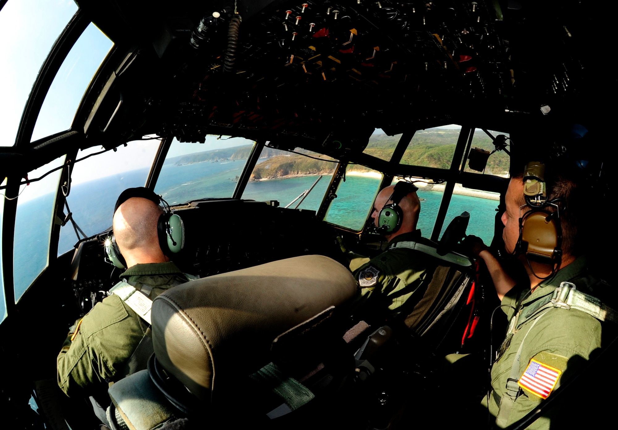 Members from 17th Special Operations Squadron fly an MC-130P Combat Shadow around the coast of Okinawa, Japan, Oct. 16, 2014 during a four-ship formation. All Pacific-based MC-130P Combat Shadow aircraft will be retired over the next year and replaced with the MC-130J Commando II. The flight marked the last time the Combat Shadows will conduct a four-ship formation at Kadena. (U.S. Air Force photo by Airman 1st Class Keith James)