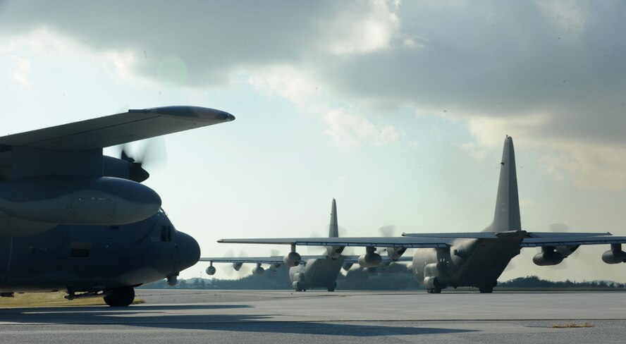 Four MC-130P Combat Shadow aircraft taxi on the runway of Kadena Air Base, Okinawa, Japan, Oct. 16, 2014. The aircraft flew in a four-ship formation to mark the retirement of the MC-130P. The first of the aircraft will retire next week, and this is the last time a four-ship Combat Shadow formation will fly at Kadena. (U.S. Air Force photo by Stephen G. Eigel)