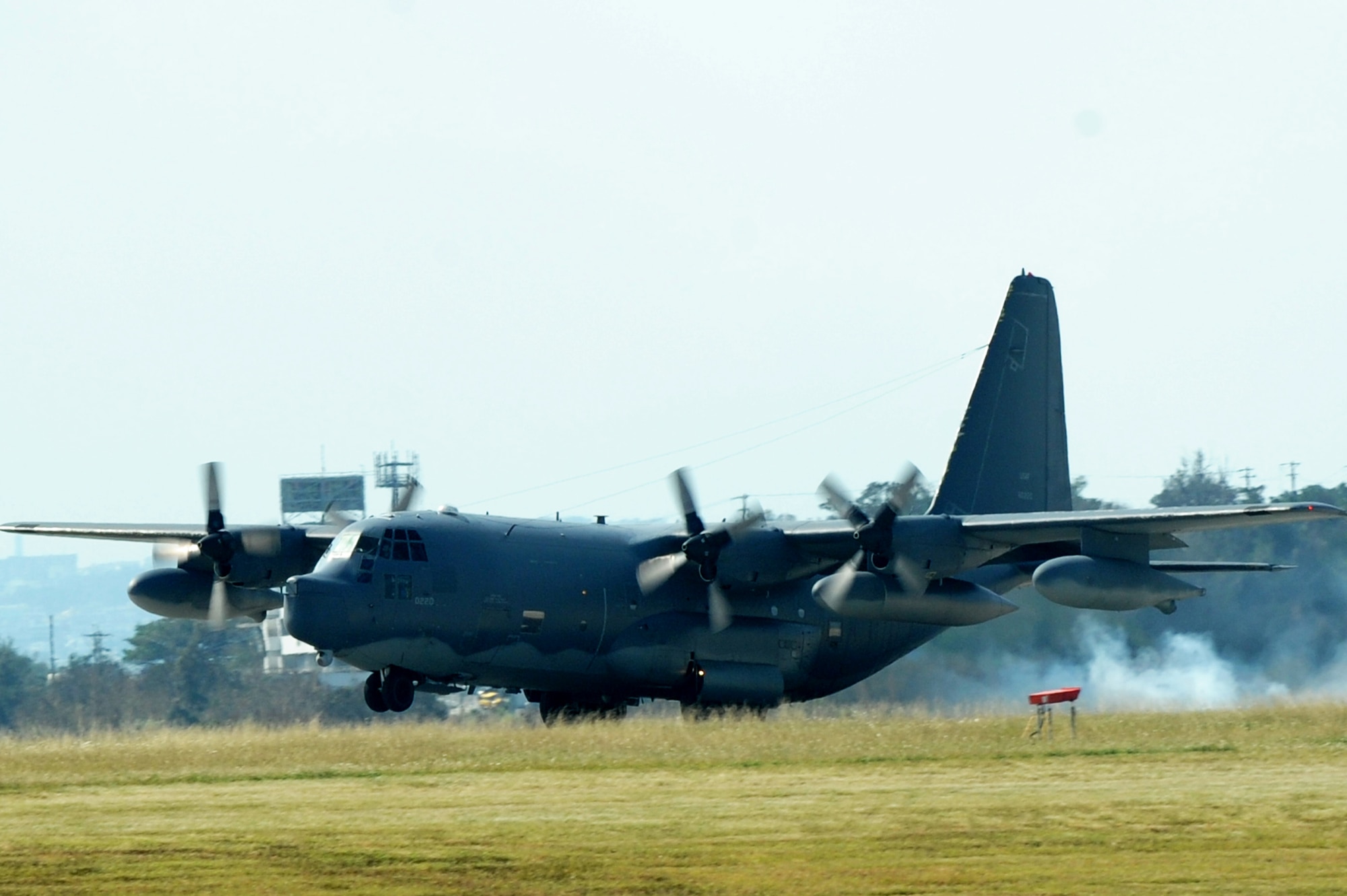 An MC-130P Combat Shadow aircraft lands on Kadena Air Base, Okinawa, Japan, Oct. 16,2014. The aircraft flew in a four-ship formation to mark its retirement. (U.S. Air Force photo by Stephen G. Eigel)