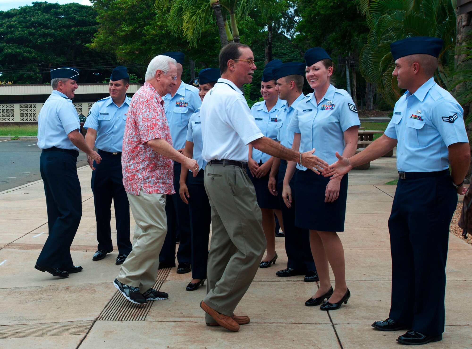 Air Force Chief of Staff Gen. Mark A. Welsh III, far left, and members of the Air Force Civic Leader Program greet Airmen assigned to Joint Base Pearl Harbor-Hickam, Oct. 14, 2014. At the invitation of Welsh, and hosted by Pacific Air Forces, the civic leaders spent three days visiting military installations and units to gain a hands-on understanding of the missions and capabilities of the Air Force, Army, Marine Corps, Navy and Coast Guard, and their respective contributions to the Pacific Rebalance. (U.S. Air Force photo/Tech. Sgt. Lucelia Ball)