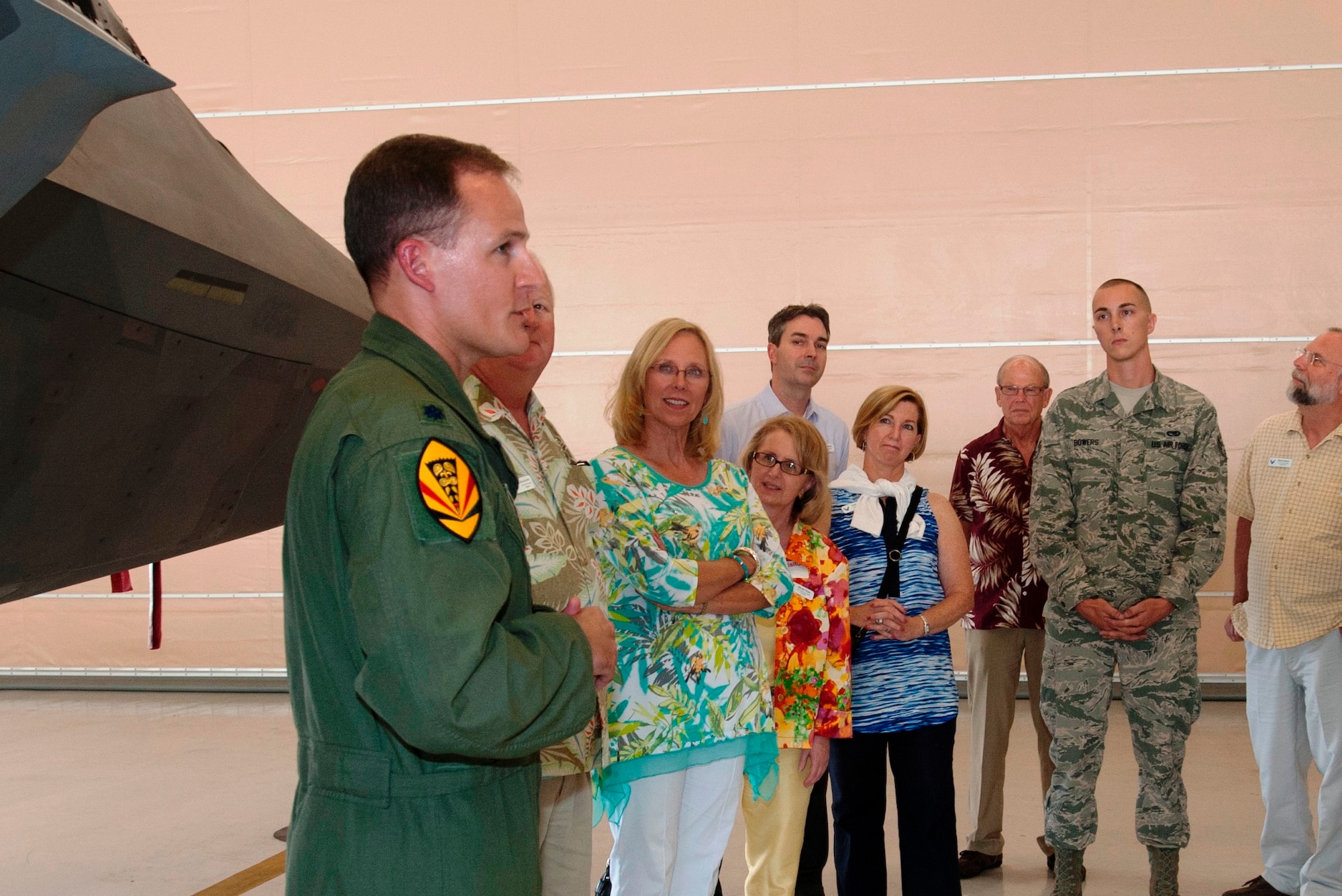 Lt. Col. Justin Spears briefs members of the Air Force Civic Leader Program on the Hawaii Air National Guard’s 154th Wing mission and the capabilities of the F-22 Raptor during the group’s visit to the wing’s new operations and maintenance facility Oct. 14, 2014, at Joint Base Pearl Harbor-Hickam. At the invitation of Air Force Chief of Staff Gen. Mark A. Welsh III, and hosted by Pacific Air Forces, the civic leaders spent three days visiting military installations and units to gain a hands-on understanding of the missions and capabilities of the Air Force, Army, Marine Corps, Navy and Coast Guard, and their respective contributions to the Pacific Rebalance. Spears is an F-22 pilot and commander of the 19th Fighter Squadron assigned to the Hawaii ANG’s 154th WG. (U.S. Air Force photo/Tech. Sgt. Lucelia Ball) 