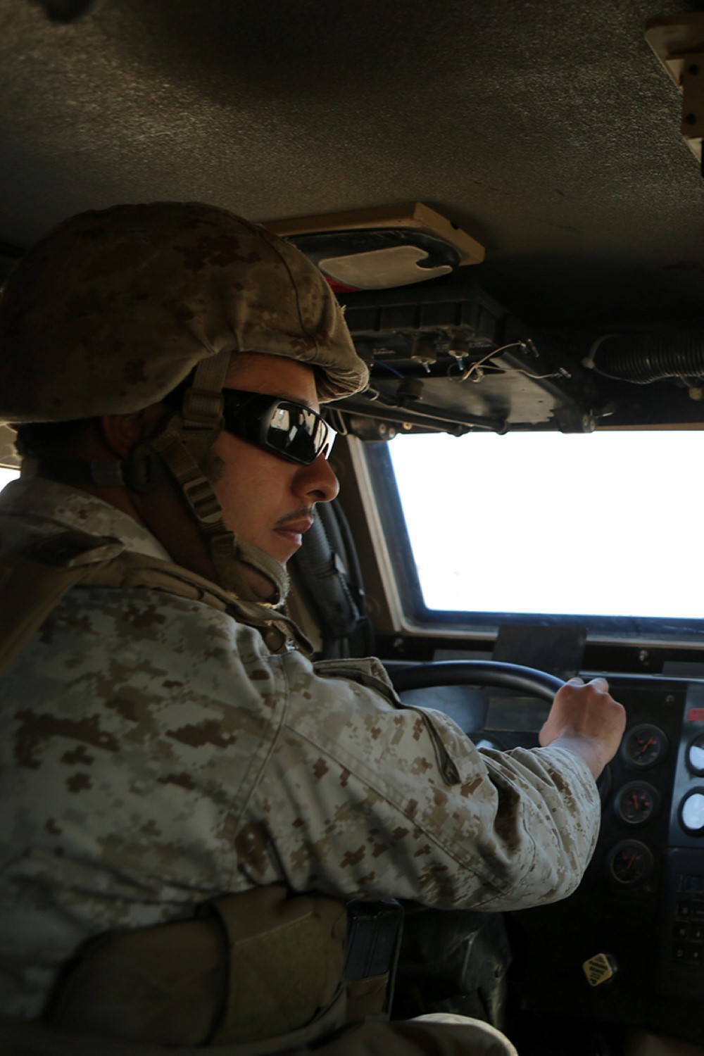 Cpl. Adrian Alonzo Jr., a motor transport operator with Combat Logistics Battalion 11, 11th Marine Expeditionary Unit (MEU), from Soledad, California, drives a Mine Resistant Ambush Protected (MRAP) vehicle during convoy training, Oct. 22. The 11th MEU is deployed with the Makin Island Amphibious Ready Group (ARG) as a theater reserve and crisis response force throughout U.S. Central Command and the U.S. 5th Fleet area of responsibility. (U.S. Marine Corps photo by Sgt. Melissa Wenger/ Released)