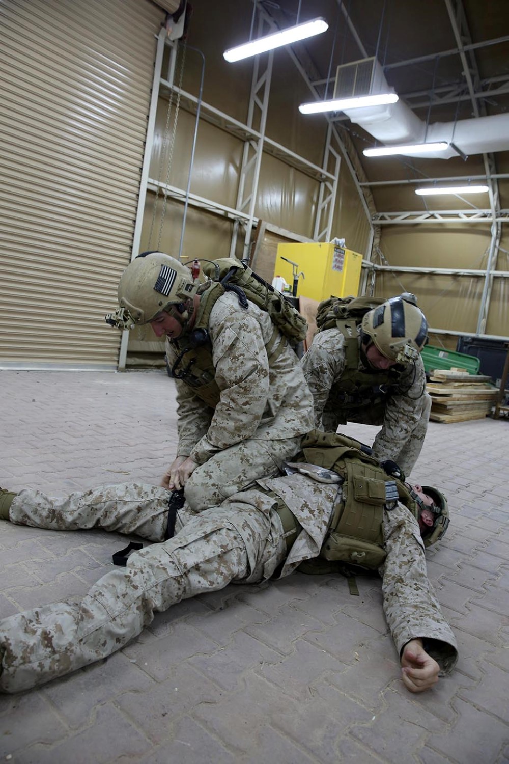Marines with the reconnaissance detachment, 11th Marine Expeditionary Unit, practice combat life-saving skills, Oct. 23. The 11th MEU is deployed with the Makin Island Amphibious Ready Group as a theater reserve and crisis response force throughout U.S. Central Command and the U.S. 5th Fleet area of responsibility. (U.S. Marine Corps photo by Cpl. Evan R. White/RELEASED)