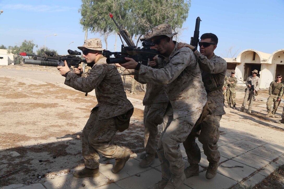 Marines with Fox Company, Battalion Landing Team 2nd Battalion, 1st Marines, 11th Marine Expeditionary Unit (MEU), demonstrate clearing procedures to the British Royal Marines during Exercise Cougar Voyage 15. Cougar Voyage is an exercise aimed to strengthen proficiencies, promote interoperability and increase military-to-military relationships to support long-term regional security in the U.S. 5th Fleet area of responsibility.  (U.S. Marine Corps photos by Cpl. Demetrius Morgan/ Released)  