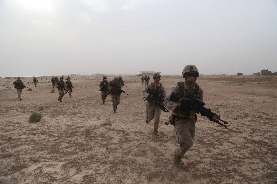 U.S. Marines with Fox Company, Battalion Landing Team 2nd Battalion, 1st Marines, 11th Marine Expeditionary Unit (MEU), rush toward their training objective with British Royal Marines assigned to Task Force Cougar as part of Exercise Cougar Voyage 15. Cougar Voyage is a joint combined ground, air and sea engagement exercise which strengthens mutual maritime capabilities and is an excellent opportunity to enhance military to military relations. (U.S. Marine Corps photos by Cpl. Demetrius Morgan/Released)  