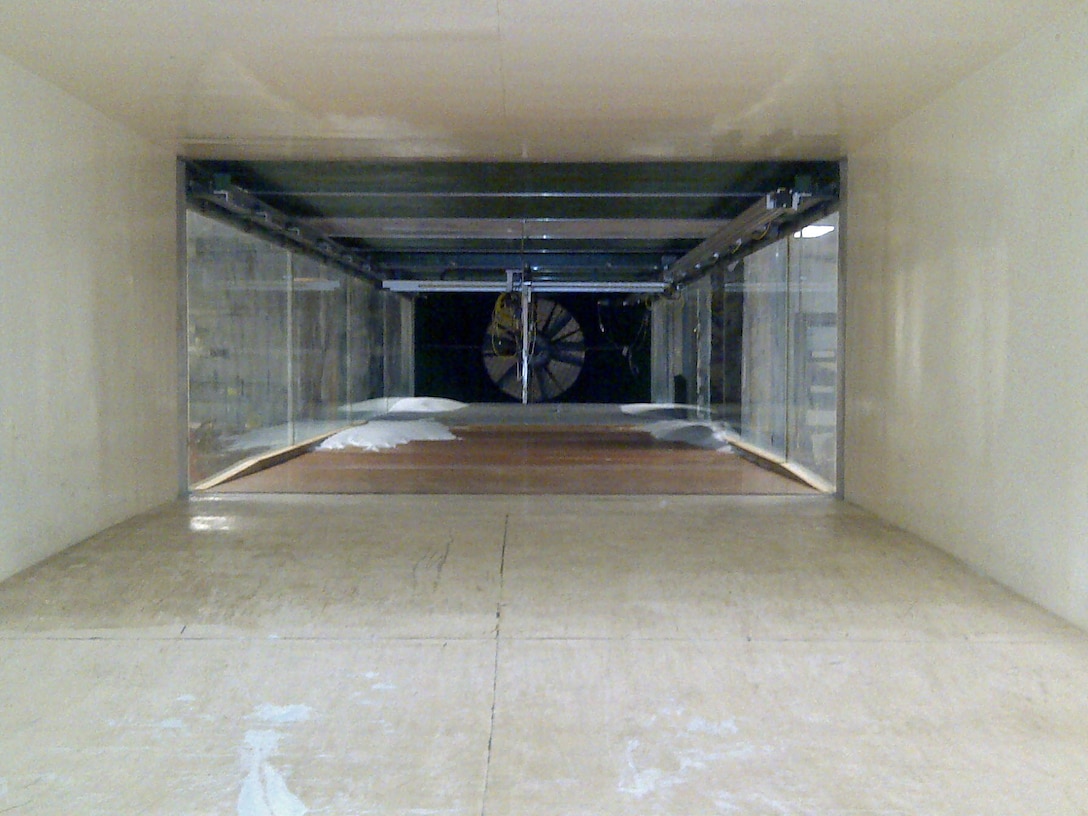 The Environmental Wind Tunnel located at ERDC-CRREL is 2.4 m wide by 1.2 m tall and can achieve air-flow velocities up to 11 m/s. The test section is 9.8m long.