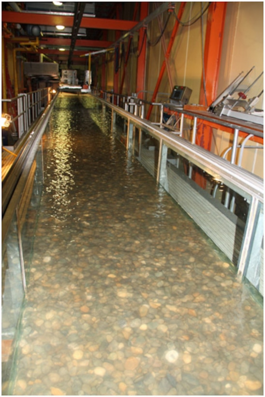 The ERDC-CRREL Ice Engineering Facility’s Flume, is a  2 ft × 4 ft × 120 ft long refrigerated, tilting bed structure that constantly recirculates water and can be used to model a wide range of basic and applied research problems involving ice and river environments. Researchers can employ a wide variety of streambed media, including sand and gravel, depending on the river environment of interest.