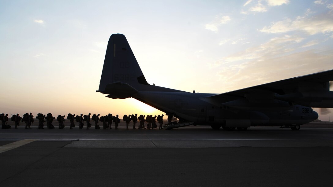 Marines and sailors with Marine Expeditionary Brigade in Afghanistan load onto a KC-130 aircraft on the Camp Bastion flightline, Oct. 27, 2014. The Marine Corps ended its mission in Helmand province, Afghanistan the day prior and all Marines, sailors and service members from the United Kingdom withdrew from southwestern Afghanistan. 

