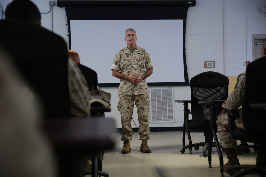 Maj. Gen. James S. Hartsell, Mobilization Assistant to Commander, United States Pacific Command and a distinguished pistol expert, addresses Reserve Marine students about the importance of marksmanship excellence at the Combat Marksmanship Coaches Course at the Marksmanship Training Unit, Weapons Training Battalion in Quantico, Va., Oct. 23, 2014. This particular CMC course was staffed entirely by Reserve Marines from the Marine Corps Reserve Shooting Team, who are the top competitive shooters in the Marine Corps Reserve.