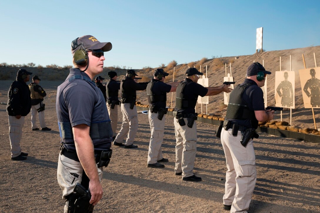 Members of the Marine Corps Logistics Base, Barstow Police Department practice close range engagement techniques on 21 October. The MCLB Barstow Police Department maintains its marksmanship skills via regularly scheduled live-fire training.