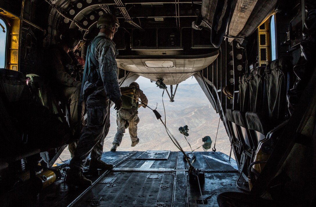 A U.S. Marine with Force Reconnaissance Detachment, 15th Marine Expeditionary Unit, jumps out of a CH-53E Super Stallion aircraft during airborne-sustainment training aboard Camp Pendleton, Calif., Oct. 21, 2014. The Force Recon Detachment is scheduled to deploy with the 15th MEU next spring. (U.S. Marine Corps photo by Sgt. Emmanuel Ramos/Released)