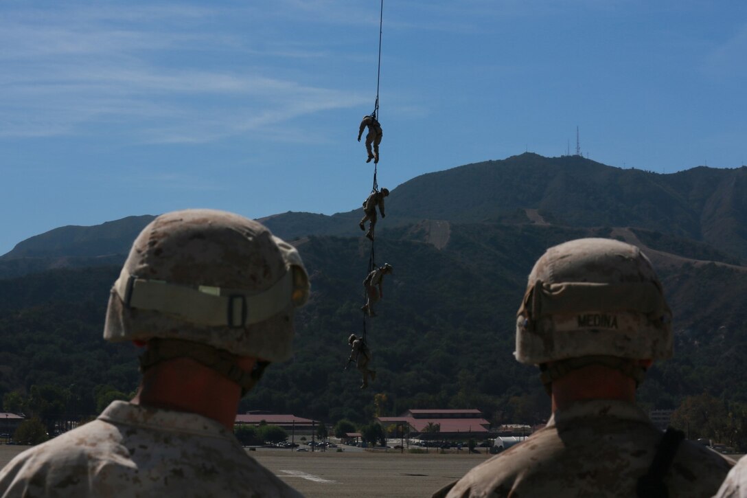 U.S. Marines with Battalion Landing Team, 3rd Battalion, 1st Marine Regiment, and various units practice special-patrol insertion and extraction rigging from a UH-1Y Huey aircraft during a helicopter rope-suspension techniques masters course aboard Camp Pendleton, Calif., Oct. 22, 2014. BLT 3/1 is scheduled to deploy as the ground combat element with the 15th Marine Expeditionary Unit next spring. (U.S. Marine Corps photo by Staff Sgt. Miguel Carrasco/Released)