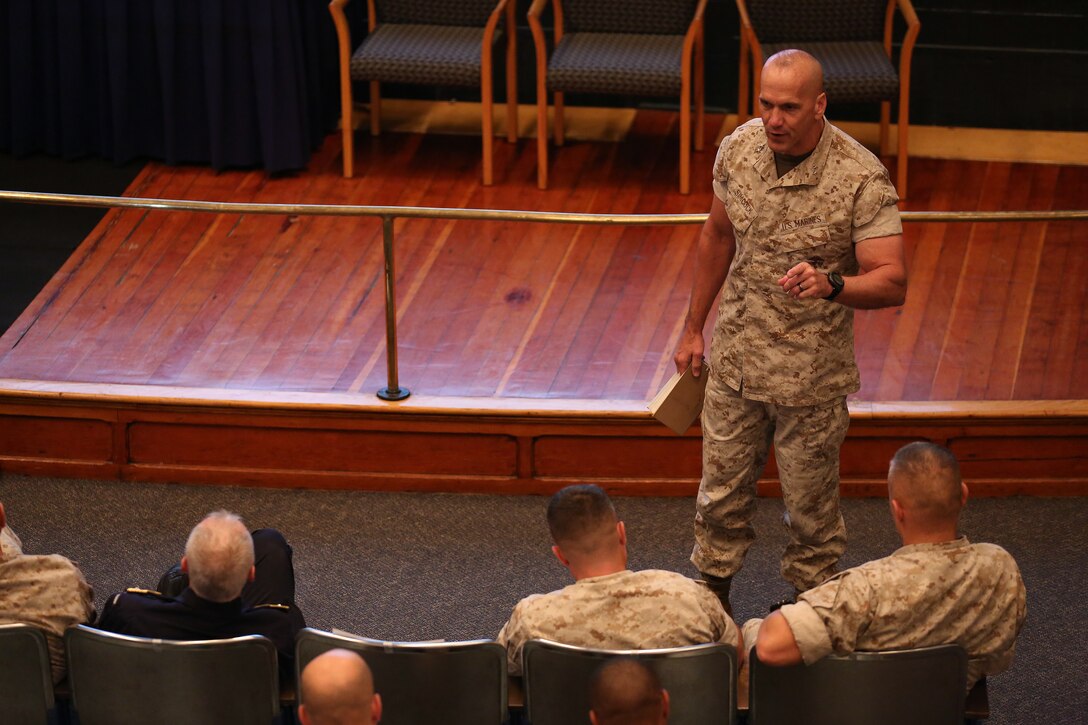 Maj. Gen Richard L. Simcock, Commanding General, 2d Marine Expeditionary Brigade (MEB), speaks with Marines, sailors and Coalition forces assigned to 2d MEB at a transition brief in support of exercise Bold Alligator 14, at Naval Operations Base Norfolk, Va., Oct. 25, 2014. Exercise Bold Alligator 14 is a multi-national, synthetic naval amphibious exercise designed to train the full range of amphibious capabilities in order to provide unique and contemporary solutions to global challenges.