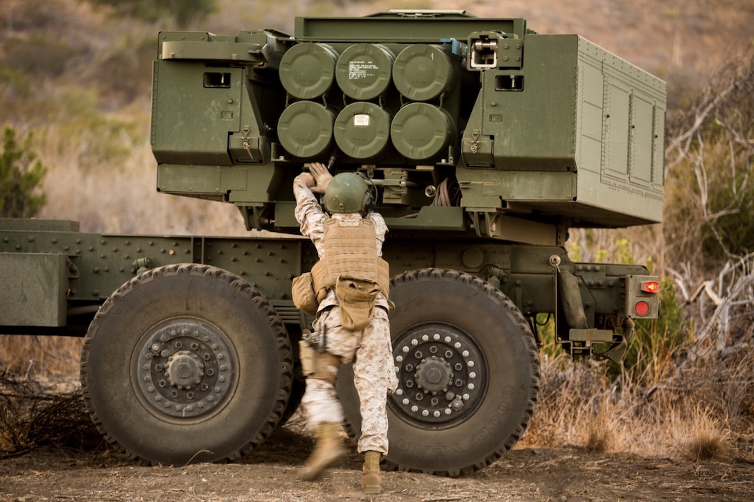 Sergeant John Matthieu, a High Mobility Artillery Rocket System operator with Battery Q, 5th Battalion, 11th Marine Regiment, inspects his HIMARS before a live-fire exercise aboard Marine Corps Base Camp Pendleton, Calif., Oct. 22, 2014. Conducting live-fire exercises strengthens the Marines’ ability to fire effectively in future operations.