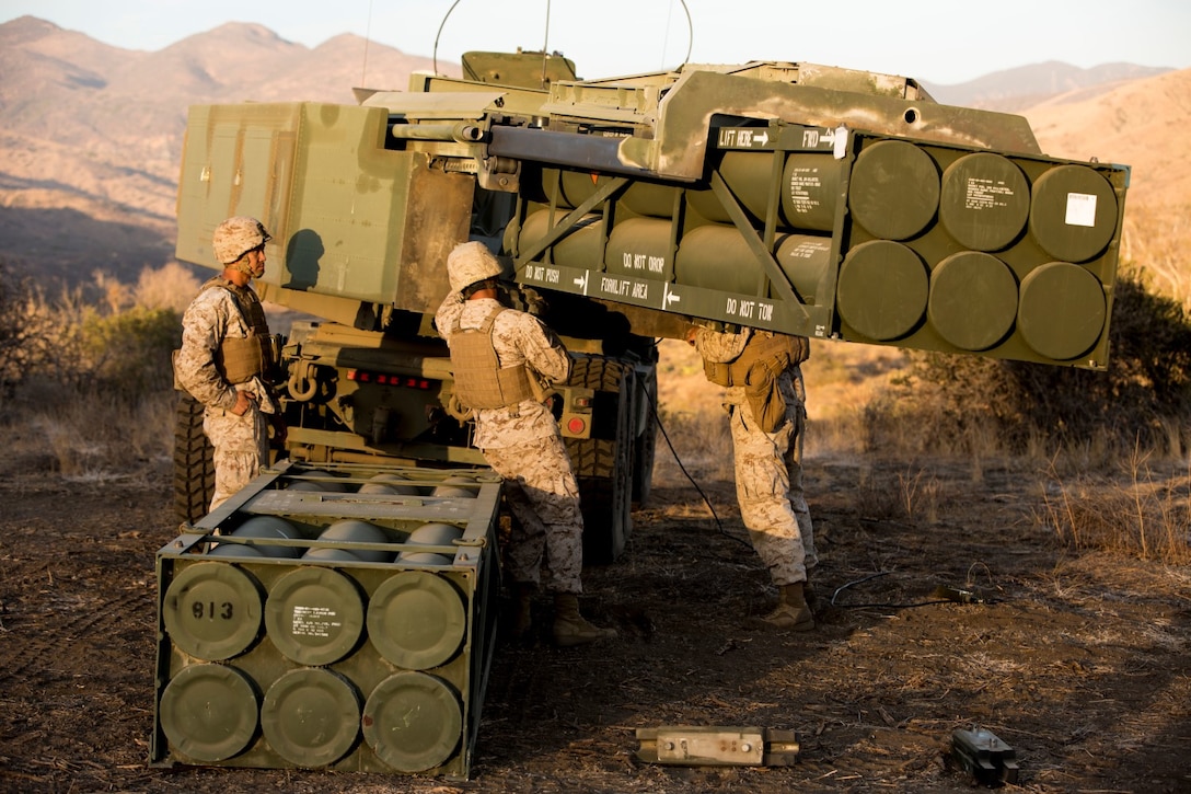 Marines with Battery Q, 5th Battalion, 11th Marine Regiment, navigate a missile pod into an M142 High Mobility Artillery Rocket System during a live-fire exercise aboard Marine Corps Base Camp Pendleton, Calif., Oct. 22, 2014. Conducting live-fire exercises strengthens the Marines’ ability to fire effectively in future operations.