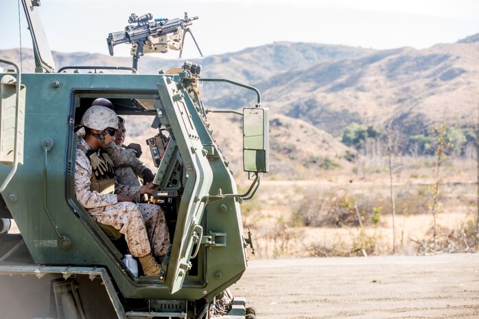 Marines with Battery Q, 5th Battalion, 11th Marine Regiment, enter coordinates into an M142 High Mobility Artillery Rocket System during a live-fire exercise aboard Marine Corps Base Camp Pendleton, Calif., Oct. 22, 2014. Conducting live-fire exercises strengthens the Marines’ ability to fire effectively in future operations.