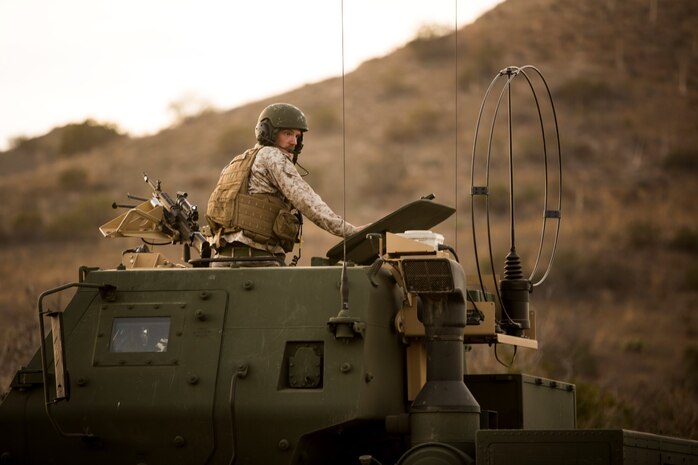 Sergeant John Matthieu, a High Mobility Artillery Rocket System operator with Battery Q, 5th Battalion, 11th Marine Regiment, supervises a rocket reload during a live-fire exercise aboard Marine Corps Base Camp Pendleton, Calif., Oct. 22, 2014. Conducting live-fire exercises strengthens the Marines’ ability to fire effectively in future operations.