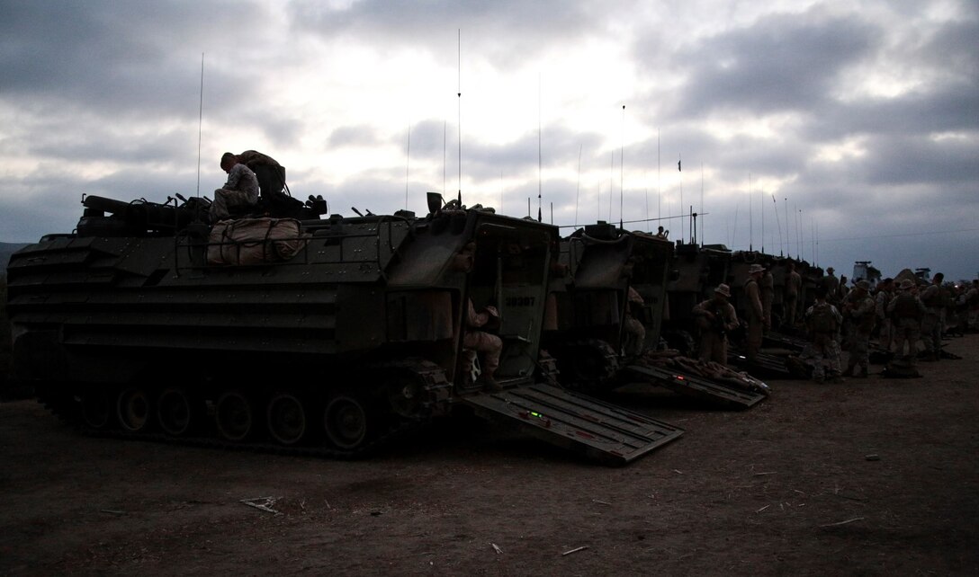 U.S. Marines with Kilo Company, Battalion Landing Team, 3rd Battalion, 1st Marine Regiment, 15th Marine Expeditionary Unit, prepare to assault a beach during a simulated mechanized raid aboard Camp Pendleton, Calif., Oct. 21, 2014. BLT 3/1 is the 15th MEU’s ground combat element. (U.S. Marine Corps photo by Cpl. Steve H. Lopez/Released)