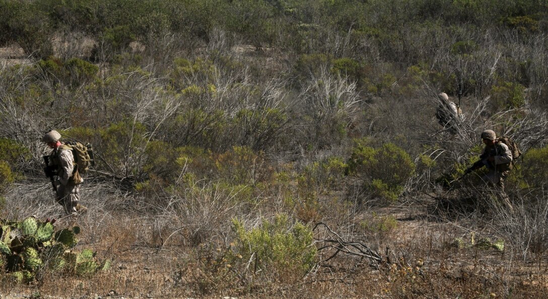 U.S. Marines with Kilo Company, Battalion Landing Team, 3rd Battalion, 1st Marine Regiment, 15th Marine Expeditionary Unit conduct movement to an objective during a simulated mechanized raid aboard Camp Pendleton, Calif., Oct. 22, 2014. BLT 3/1 is the 15th MEU’s ground combat element. (U.S. Marine Corps photo by Cpl. Steve H. Lopez/Released)