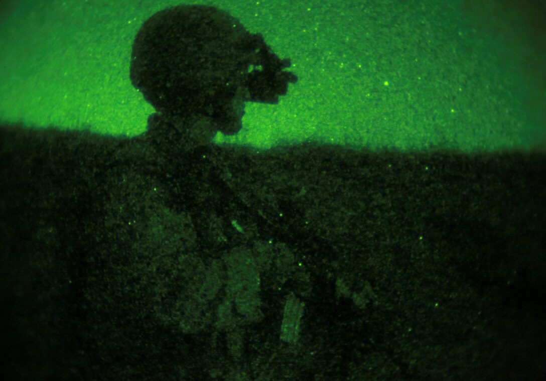 U.S. Marine Lance Cpl. Jaime Camacho provides security during a simulated mechanized night raid aboard Camp Pendleton, Calif., Oct. 23, 2014. Camacho is an automatic rifleman with Kilo Company, Battalion Landing Team, 3rd Battalion, 1st Marine Regiment, 15th Marine Expeditionary Unit. BLT 3/1 is the 15th MEU’s ground combat element. (U.S. Marine Corps photo by Cpl. Steve H. Lopez/Released)