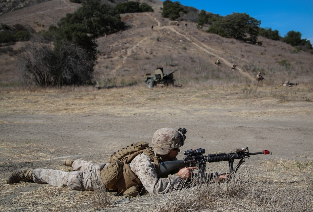 U.S. Marine Lance Cpl. Trevor Glover provides security during a simulated mechanized raid aboard Camp Pendleton, Calif., Oct. 20, 2014. Glover is a rifleman with Kilo Company, Battalion Landing Team, 3rd Battalion, 1st Marine Regiment, 15th Marine Expeditionary Unit. BLT 3/1 is the 15th MEU’s ground combat element. (U.S. Marine Corps photo by Cpl. Steve H. Lopez/Released)