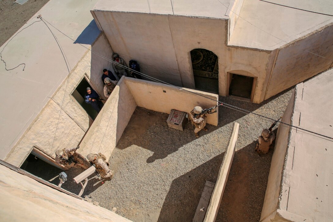 Marines with 1st Platoon, Company C, 1st Battalion, 4th Marine Regiment, conduct urban operations training at the Infantry Immersion Trainer aboard Marine Corps Base Camp Pendleton, Calif., Oct. 24, 2014. The IIT assists Marines in sharpening their basic combat skills by creating a realistic combat environment. Civilian role players occupy the training town, acting as either innocent bystanders, allied armed forces, law enforcement personnel or enemy insurgents, most of whom don’t speak English when in character.