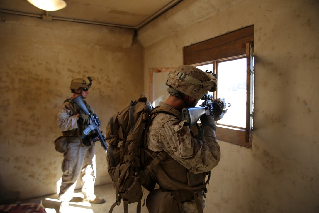 Marines with 1st Platoon, Company C, 1st Battalion, 4th Marine Regiment, conduct urban operations training at the Infantry Immersion Trainer aboard Marine Corps Base Camp Pendleton, Calif., Oct. 24, 2014. The IIT assists Marines in sharpening their basic combat skills by creating a realistic combat environment. Civilian role players occupy the training town, acting as either innocent bystanders, allied armed forces, law enforcement personnel or enemy insurgents, most of whom don’t speak English when in character.