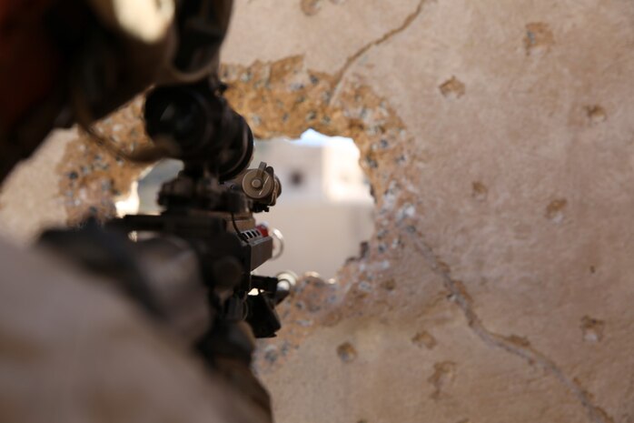 Marines with 1st Platoon, Company C, 1st Battalion, 4th Marine Regiment, conduct urban operations training at the Infantry Immersion Trainer aboard Marine Corps Base Camp Pendleton, Calif., Oct. 24, 2014. The IIT assists Marines in sharpening their basic combat skills by creating a realistic combat environment. Civilian role players occupy the training town, acting as either innocent bystanders, allied armed forces, law enforcement personnel or enemy insurgents, most of whom don’t speak English when in character.