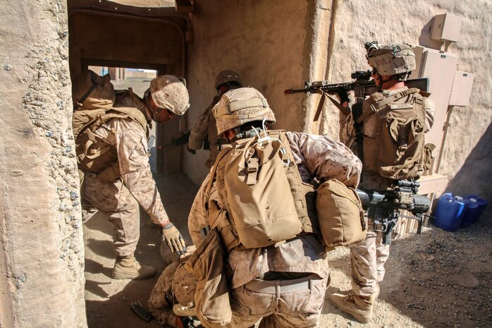 Marines with 1st Platoon, Company C, 1st Battalion, 4th Marine Regiment, conduct urban operations training at the Infantry Immersion Trainer aboard Marine Corps Base Camp Pendleton, Calif., Oct. 24, 2014. The IIT assists Marines in sharpening their basic combat skills by creating a realistic combat environment. Civilian role players occupy the training town, acting as either innocent bystanders, allied armed forces, law enforcement personnel or enemy insurgents, most of whom don’t speak English when in character.