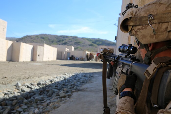 Marines with 1st Platoon, Company C, 1st Battalion, 4th Marine Regiment, conduct urban operations training at the Infantry Immersion Trainer aboard Marine Corps Base Camp Pendleton, Calif., Oct. 24, 2014. The IIT assists Marines in sharpening their basic combat skills by creating a realistic combat environment. Civilian role players occupy the training town, acting as either innocent bystanders, allied armed forces, law enforcement personnel or enemy insurgents, most of whom don’t speak English when in character.