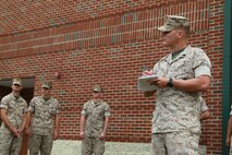 U.S. Marine Corps Sgt. Joseph C. Riley, right, noncommissioned officer in charge of the deployments section, takes accountability of his working detail during Exercise Vigilant Response 2014 (VR14) aboard Marine Corps Air Station New River, N.C., Oct. 7, 2014. VR14 is a two-day exercise designed to test the ability to conduct command and control measures in response to a pandemic outbreak aboard the Air Station.
