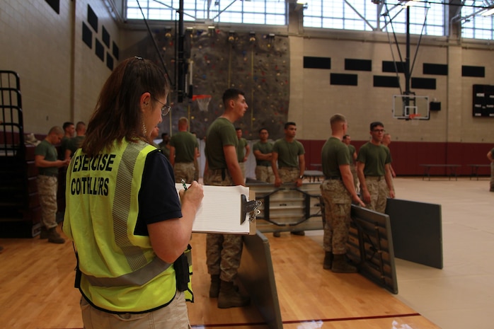 Pamela Brown of Onslow County Health Department takes notes during Exercise Vigilant Response 2014 (VR14) aboard Marine Corps Air Station New River, N.C., Oct. 7, 2014.  VR14 was a two-day exercise designed to test the ability to conduct command and control measures in response to a pandemic outbreak aboard the Air Station.