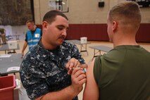 U.S. service members participate in exercise Vigilant Response 2014 (VR14) aboard Marine Corps Air Station New River, N.C., Oct. 7, 2014.  VR14 was a two-day exercise designed to test the ability to conduct command and control measures in response to a pandemic outbreak aboard the Air Station.