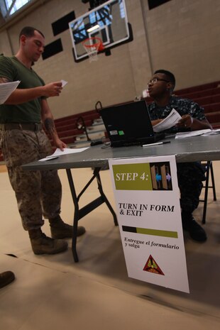 U.S. service members participate in Exercise Vigilant Response 2014 (VR14) aboard Marine Corps Air Station New River, N.C., Oct. 7, 2014. VR14 was a two-day exercise designed to test the ability to conduct command and control measures in response to a pandemic outbreak aboard the Air Station.