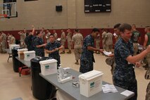 U.S. Marines and Sailors participate in Exercise Vigilant Response 2014 (VR14) aboard Marine Corps Air Station New River, N.C., Oct. 8, 2014. VR14 was a two-day exercise designed to test the ability to conduct command and control measures in response to a pandemic outbreak.