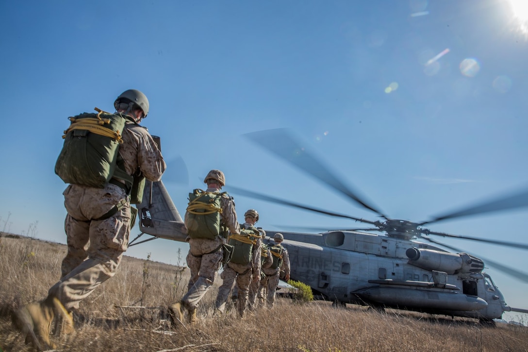 U.S. Marines with Force Reconnaissance Detachment, 15th Marine Expeditionary Unit, load onto a CH-53E Super Stallion aircraft during airborne-sustainment training aboard Camp Pendleton, Calif., Oct. 21, 2014. The Force Recon Detachment is scheduled to deploy with the 15th MEU next spring. (U.S. Marine Corps photo by Sgt. Emmanuel Ramos/Released)