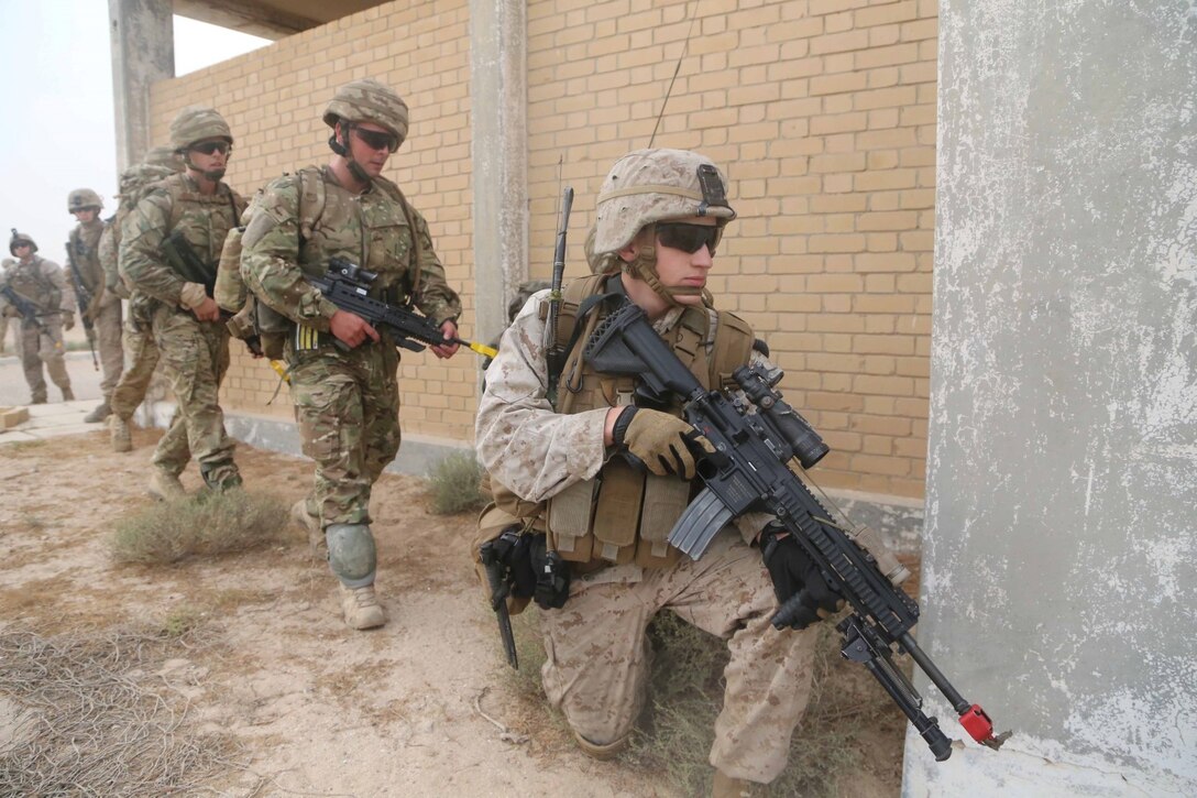 Cpl. Jordan Tompkins, a rifleman with Fox Company, Battalion Landing Team 2nd Battalion, 1st Marines, 11th Marine Expeditionary Unit (MEU), and designated communication specialists with the British Royal Marines, practice establishing a security parameter during Exercise Cougar Voyage 15. Cougar Voyage 15 is a joint combined ground, air and sea engagement exercise, which strengthens mutual maritime capabilities and is an excellent opportunity to enhance military-to-military relations. (U.S. Marine Corps photos by Cpl. Demetrius Morgan/Released)  