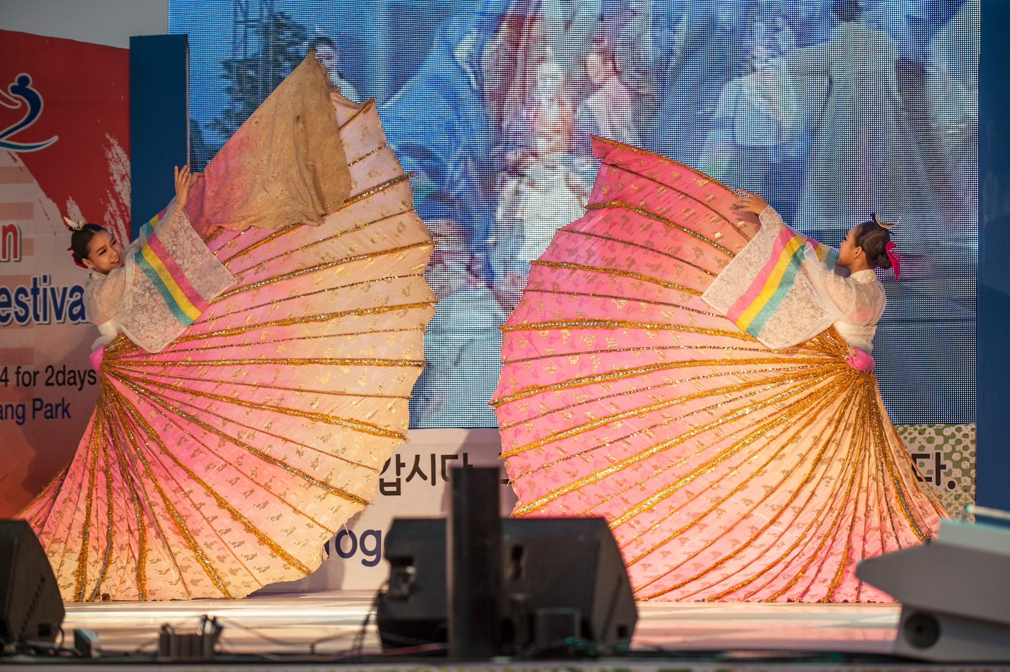 Korean woman perform a traditional Korean dance during the 11th Korean American Friendship Cultural Festival at the Songtan Entertainment District, Republic of Korea, Oct. 25, 2014. Korean traditional dances originated in ancient shamanistic rituals thousands of years ago. (U.S. Air Force photo by Senior Airman Matthew Lancaster)